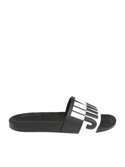 Shop Jimmy Choo Rey / M Leather Slippers With Relief Logo In Black/white