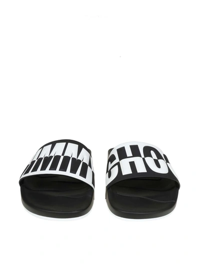 Shop Jimmy Choo Rey / M Leather Slippers With Relief Logo In Black/white