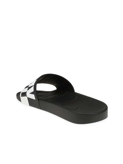 Shop Jimmy Choo Rey / M Leather Slippers With Relief Logo In Black/white