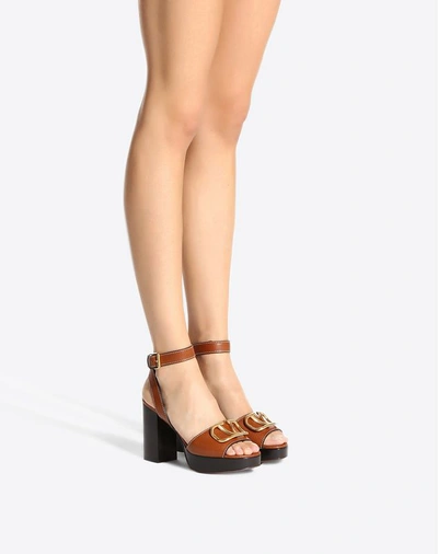 Shop Valentino Garavani Grainy Cowhide Sandal With Vlogo Detail 100 Mm In Tan