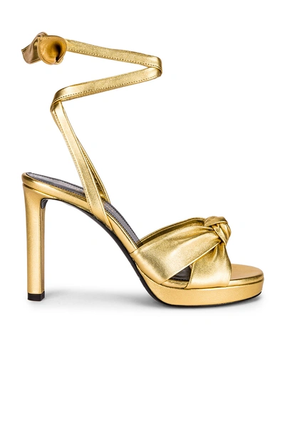 Shop Saint Laurent Hall Bow Heel In Gold