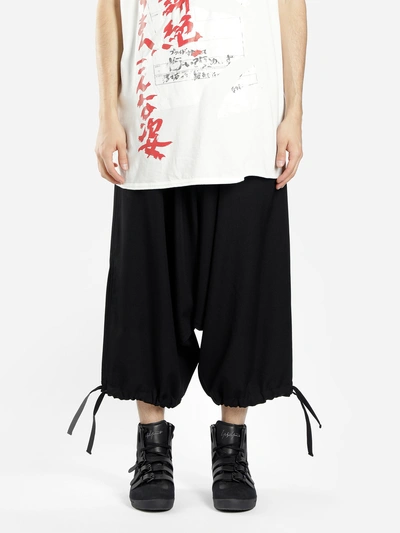 Shop Yohji Yamamoto Trousers In Black