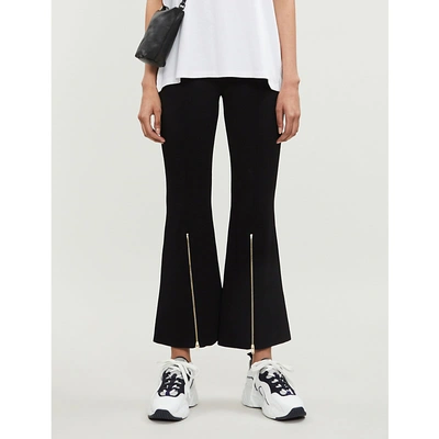 Shop Stella Mccartney Flared Knitted Trousers In Black