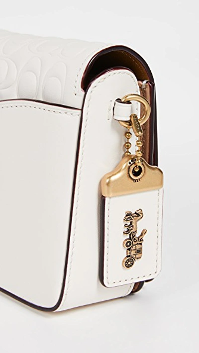 Shop Coach Signature Leather Dinky Crossbody With Leather Strap In Chalk