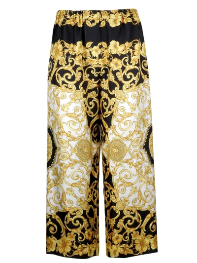 Shop Versace Trousers In Nero Stampa Oro