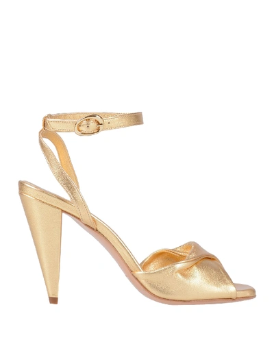 Shop Maje Sandals In Gold