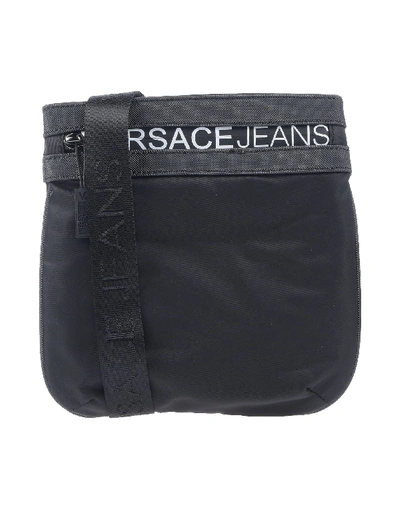 Shop Versace Jeans Cross-body Bags In Black