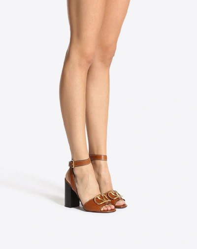 Shop Valentino Garavani Grainy Cowhide Sandal With Vlogo Detail 100mm In Tan