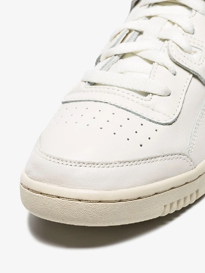 Shop Reebok White Workout Lo Plus Low Top Leather Sneakers In White/green