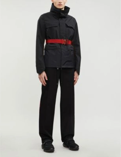 Shop Burberry Text-embroidered Regular-fit Cotton Trousers In Black