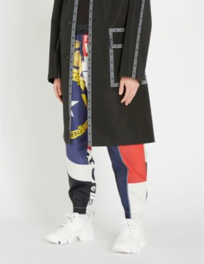 Shop Versace News-print Shell Jogging Bottoms In White Red Blue