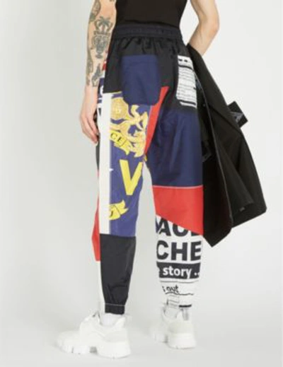 Shop Versace News-print Shell Jogging Bottoms In White Red Blue