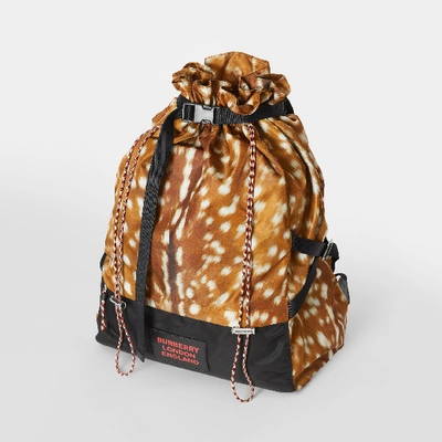 Shop Burberry Deer Print Nylon Drawcord Backpack In Tan/white