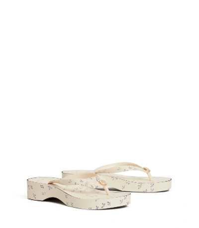 Shop Tory Burch Printed Carved-wedges Flip Flops In Ivory Early Bird