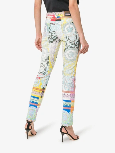 Shop Versace Baroque Print Kick Flare Slim Fit Jeans In A7000 Multicoloured