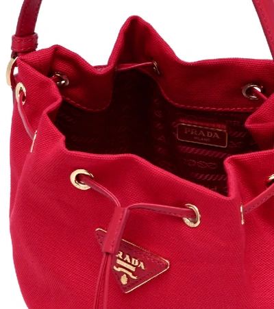Shop Prada Canvas And Wicker Bucket Bag In Red