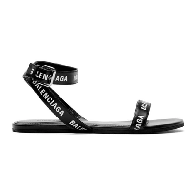 Shop Balenciaga Black Logo Strappy Flat Sandals In 1006 Black