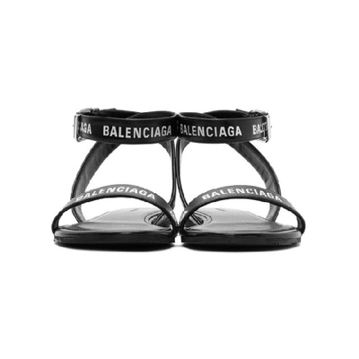 Shop Balenciaga Black Logo Strappy Flat Sandals In 1006 Black