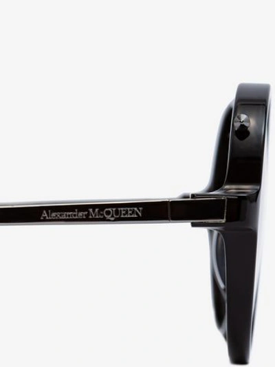 Shop Alexander Mcqueen Piercing Round Acetate Sunglasses In Black