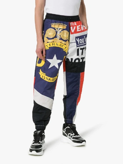 Shop Versace Multi Print Drawstring Track Pants In Blue