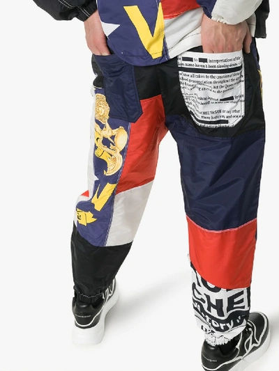 Shop Versace Multi Print Drawstring Track Pants In Blue