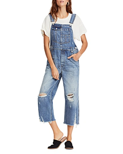 Shop Free People Distressed Cropped Denim Overalls In Light Denim