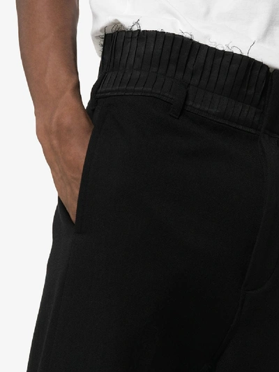 Shop Ann Demeulemeester Pleated Waist Raw Hem Cropped Trousers In 099 Black