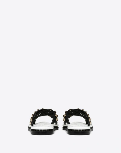 Shop Valentino Garavani Flat Slide Sandal With Crossover Straps In Black