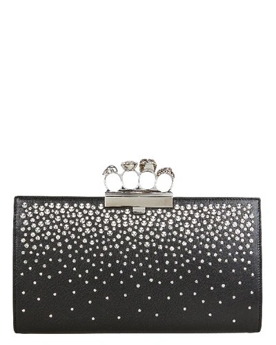 Shop Alexander Mcqueen Skull Four Ring Studded Leather Clutch In Black