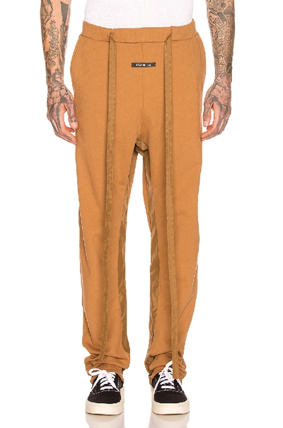 Shop Fear Of God Relaxed Sweatpant In Rust