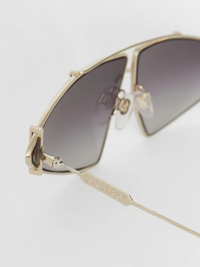 Shop Burberry Gold-plated Triangular Frame Sunglasses In Black