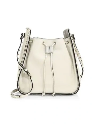 Shop Valentino Rockstud Small Leather Bucket Bag In Ivory