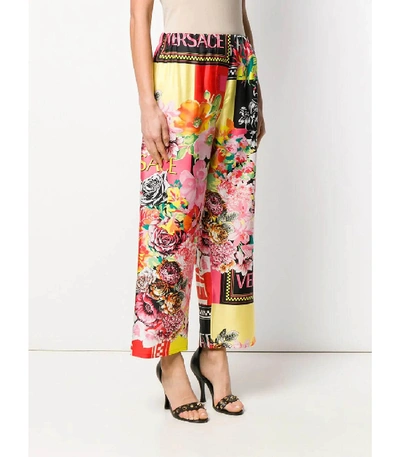 Shop Versace Silk Floral Pants In Multi