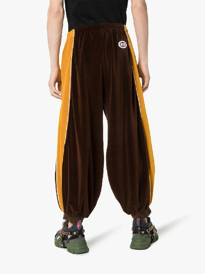 Shop Gucci Sultan Baggy Velvet Track Pants In 2215 Brown