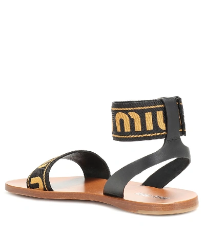 Shop Miu Miu Logo Leather Sandals In Black