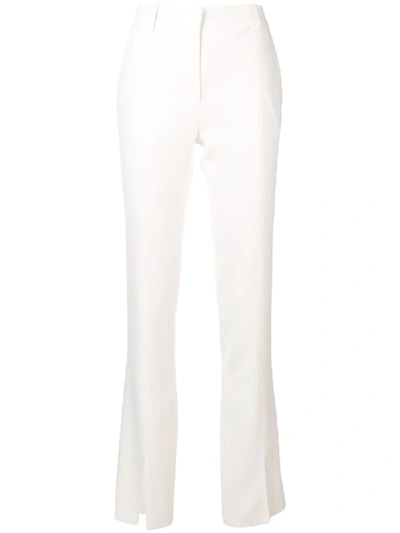 Shop Victoria Beckham Ankle Slit Slim-fit Trousers - White