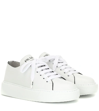 Shop Prada Leather Sneakers In White