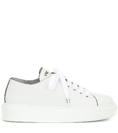 Shop Prada Leather Sneakers In White