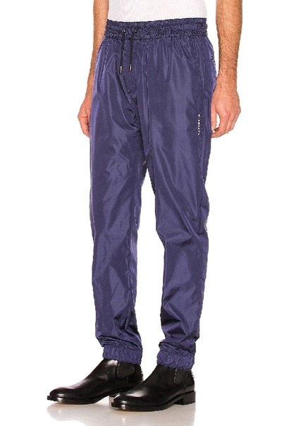 Shop Givenchy Vertical Logo Track Pants In Blue In Navy