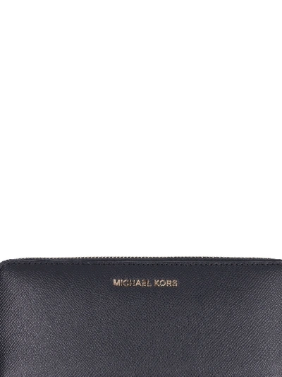 Shop Michael Kors Saffiano Leather Continental Jet Set Travel Wallet In Black