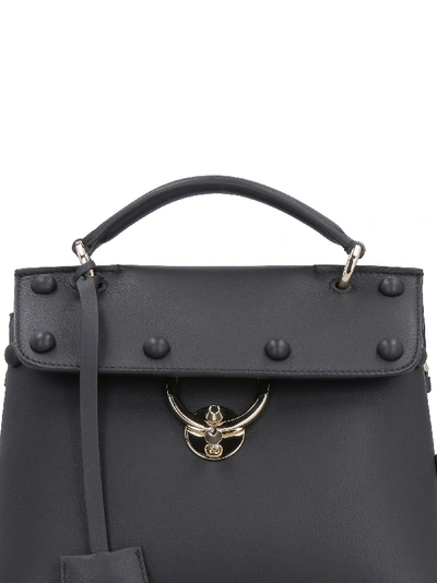Shop Ferragamo Studded Leather Handbag In Black