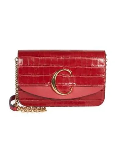 Shop Chloé C Croc-embossed Leather Clutch In Dusky Red
