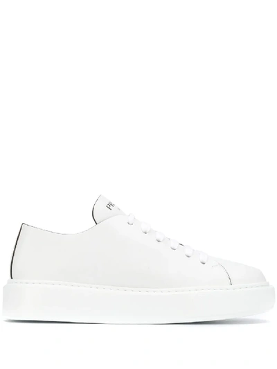 Shop Prada Low-top Leather Sneakers - White