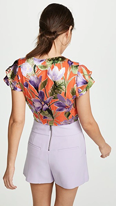 Shop Alice And Olivia Zabel Cropped Wrap Top In Floral Palm Coral