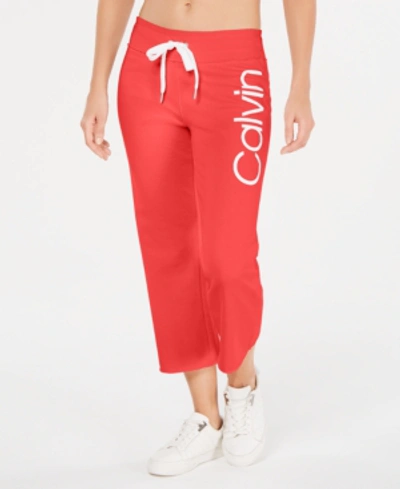 Shop Calvin Klein Performance Logo Cropped Sweatpants In Blood Orange