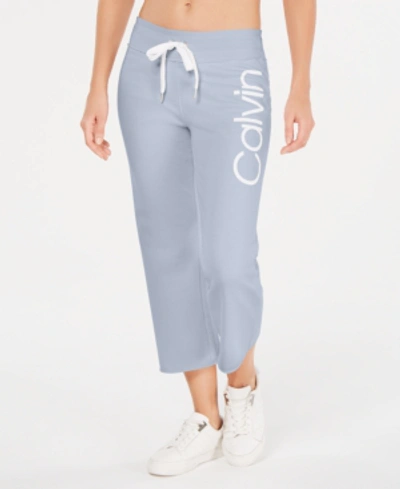 Shop Calvin Klein Performance Logo Cropped Sweatpants In Waterfall