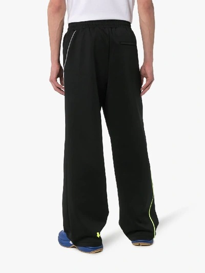 Shop Ader Error Side Stripe Wide Leg Track Pants In Black