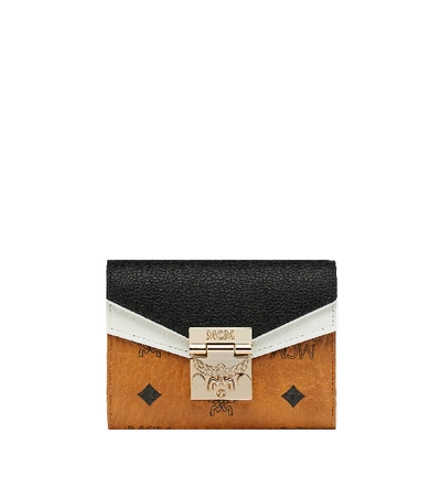 Shop Mcm Patricia Three Fold Wallet In Visetos Leather Block In Cognac & Black