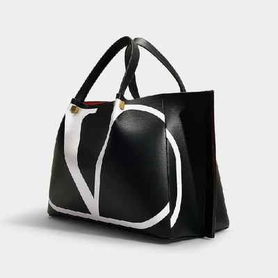 Shop Valentino Garavani | Medium Tote Go Logo In Black And White Calfskin