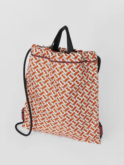 Shop Burberry Monogram Print Nylon Drawcord Backpack In 버밀리언